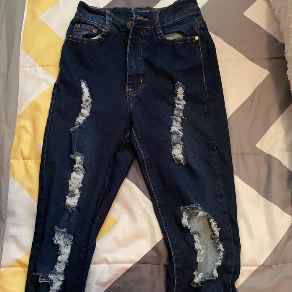 Distressed dark jeans